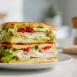 Avocado cottage cheese flatbread stacked with turkey and lettuce