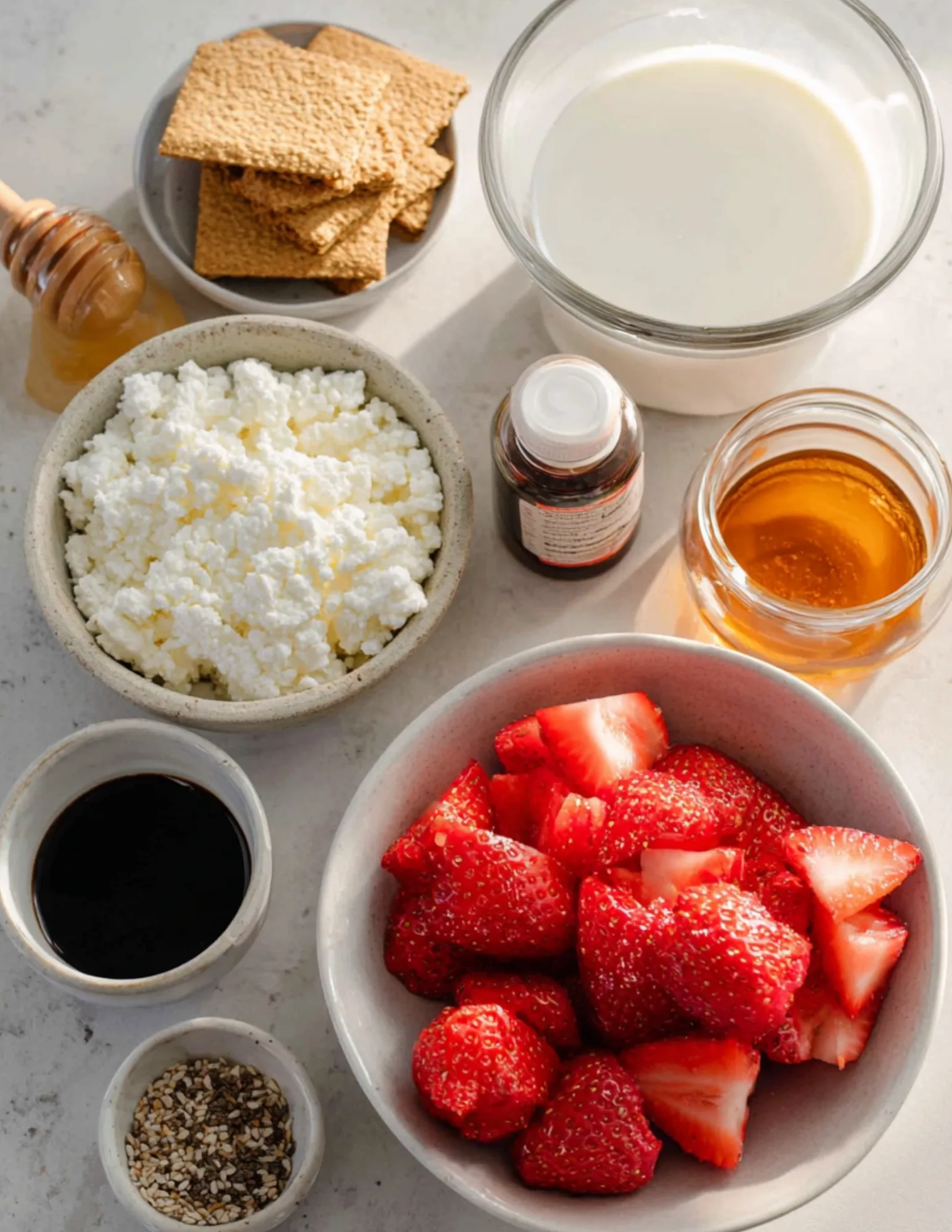 Ingredients for cheesecake cottage cheese smoothie including strawberries and flaxseed