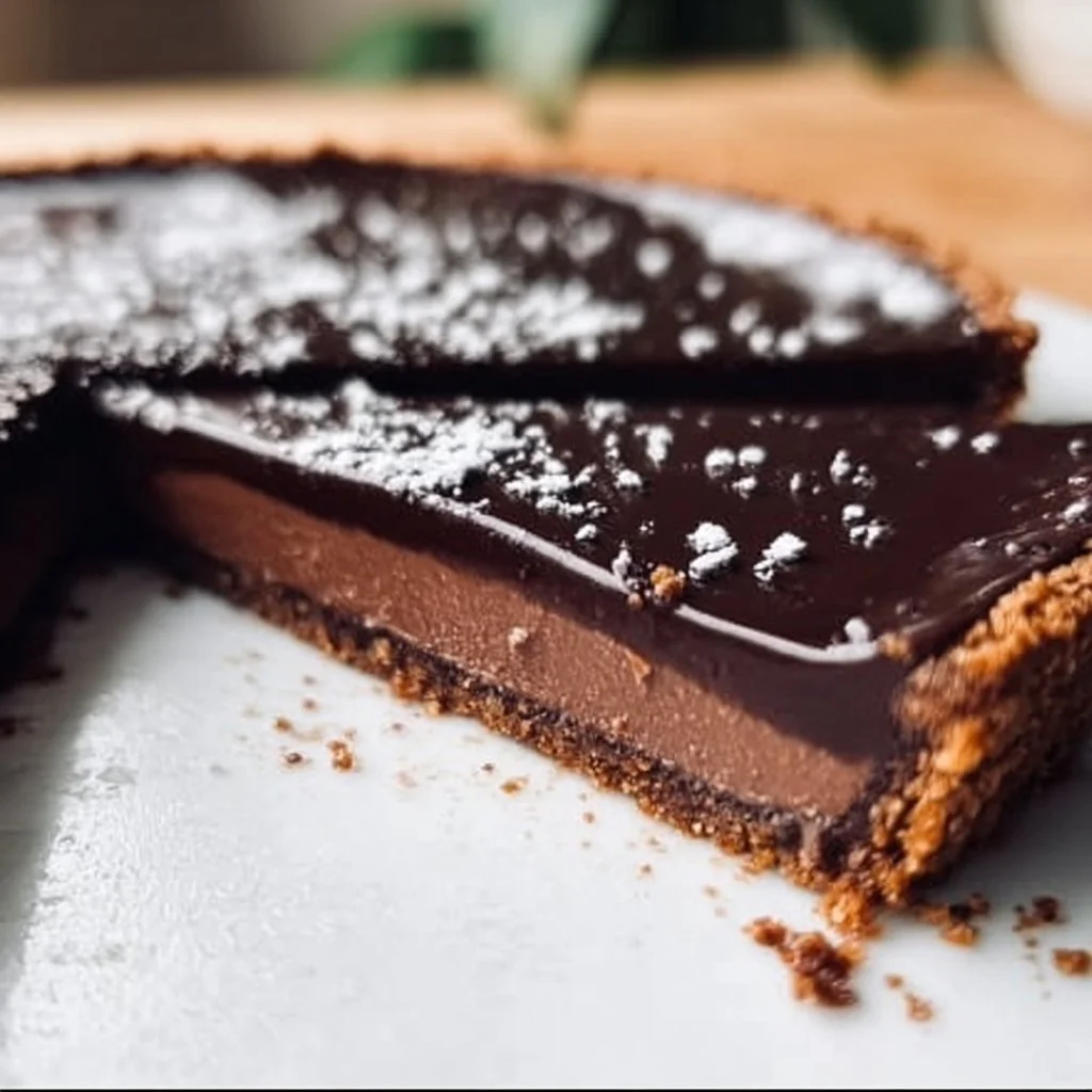 Delicious Chocolate Ganache Tart with a rich chocolate filling and crust