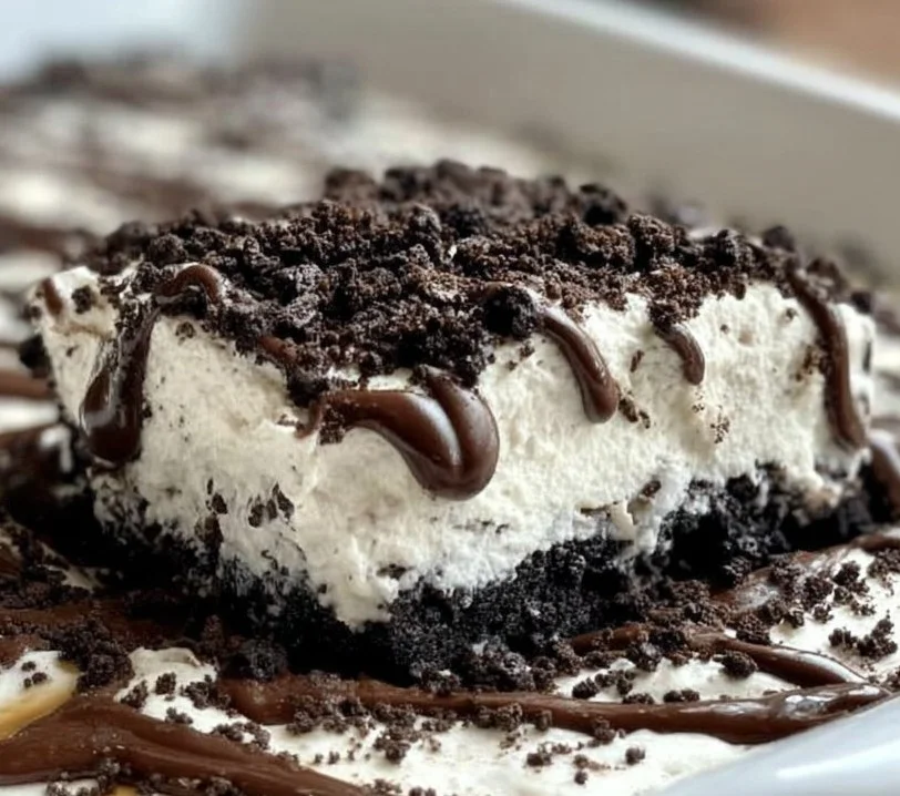 Easy Frozen Oreo Dessert served in a dish with crushed Oreos on top